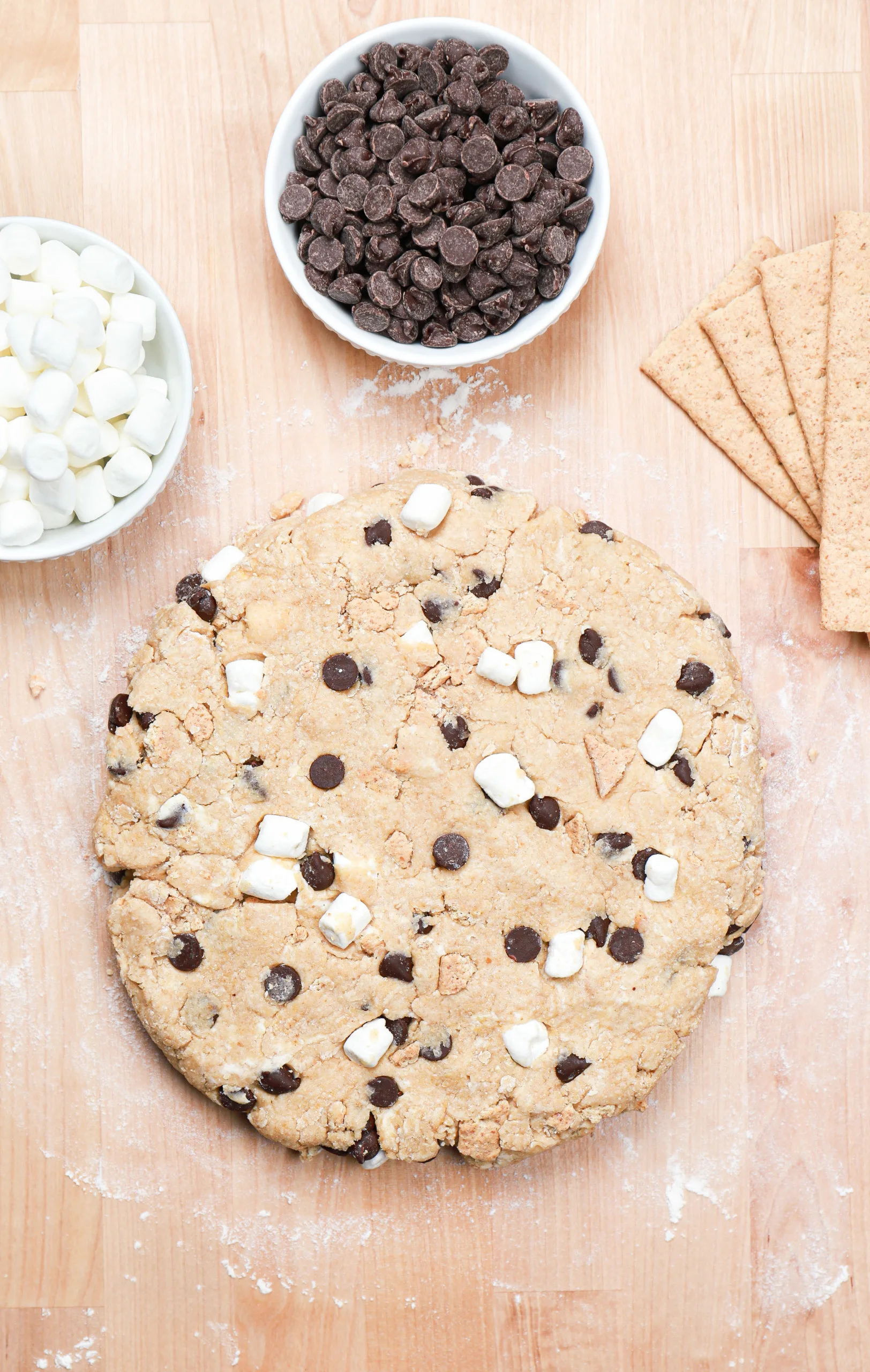 S'mores scone dough patted into an 8 inch round before cutting into pieces.