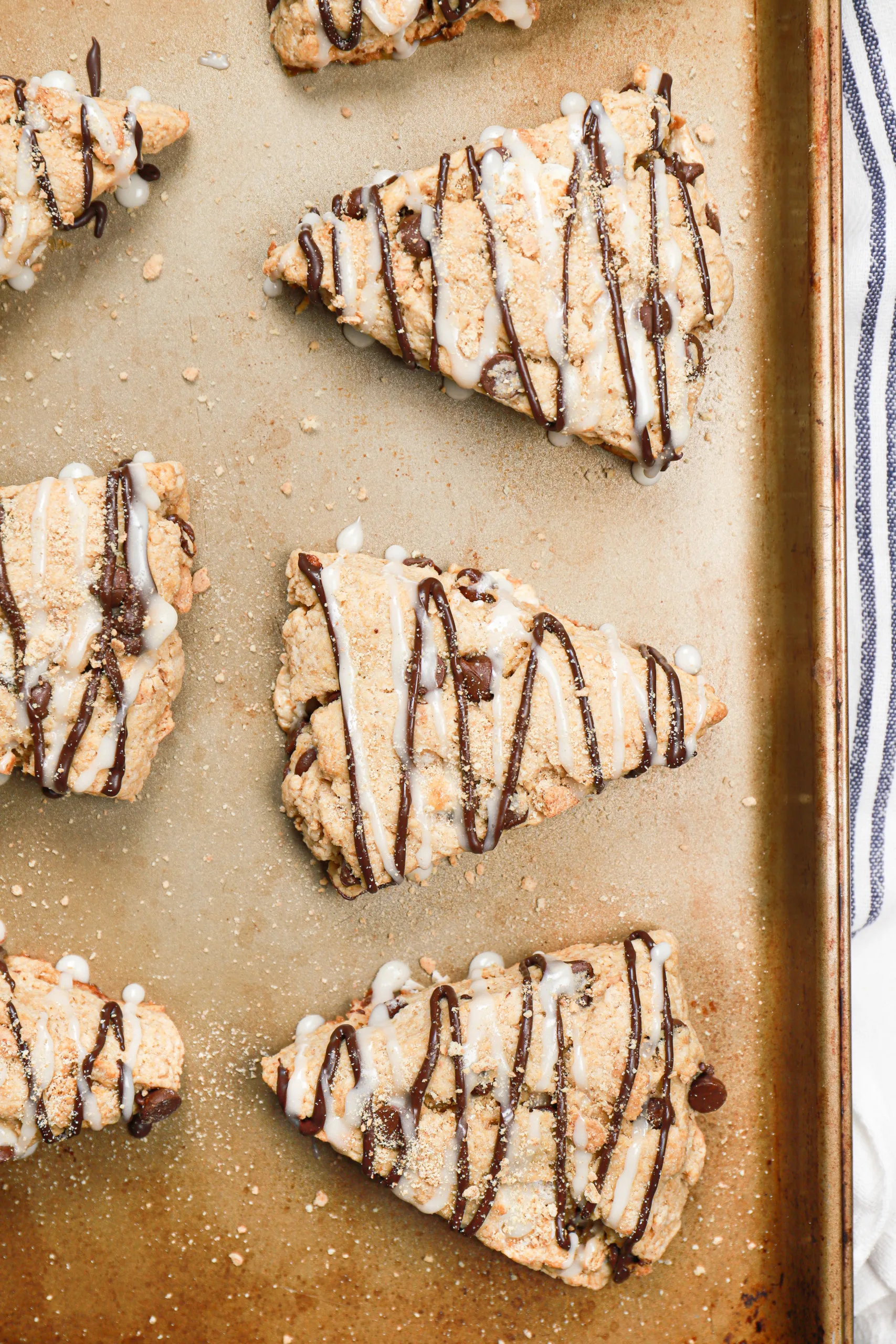 Up close overhead view of batch of s'mores scone on a baking sheet.